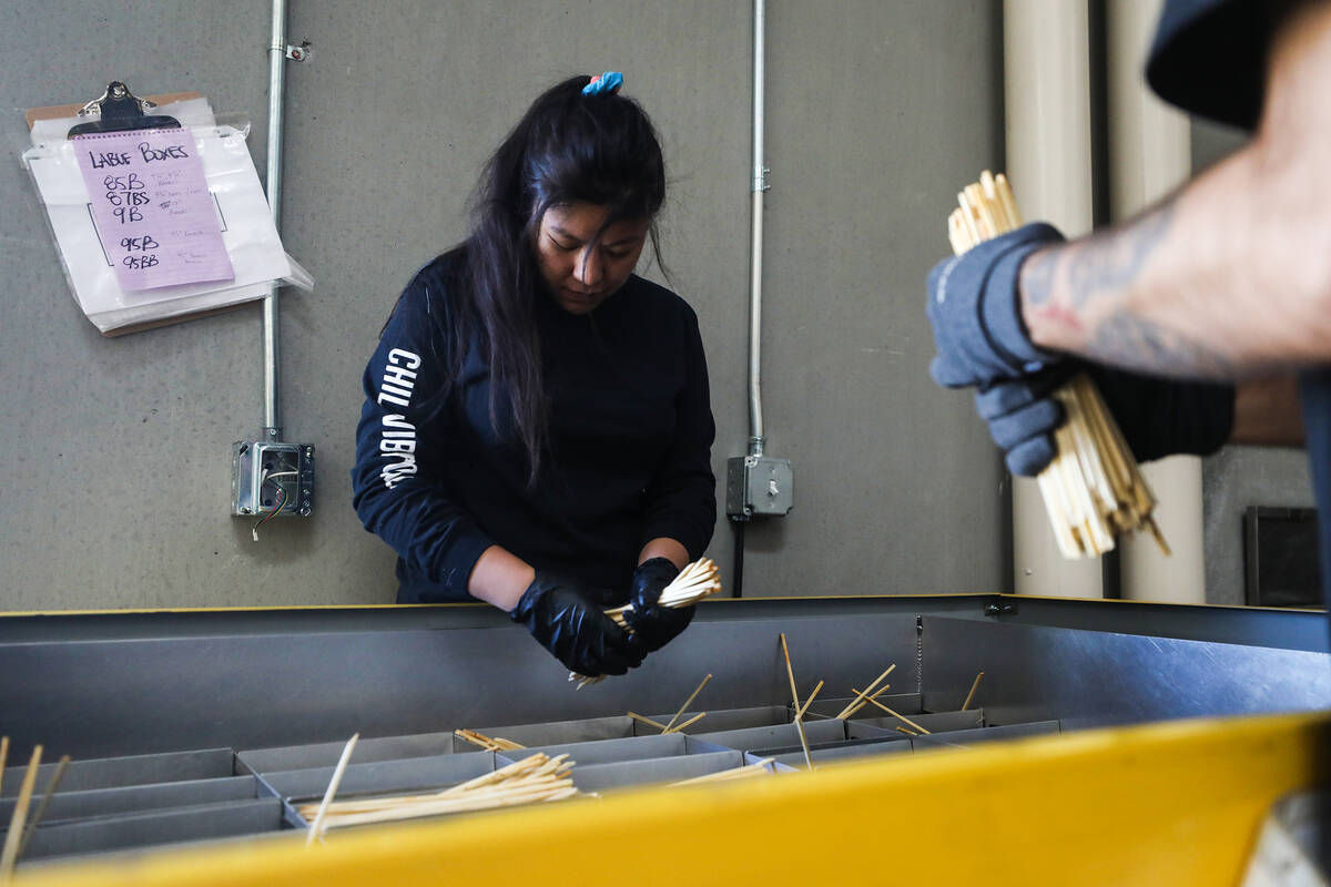 Jorese Lgtiben sorts used chopsticks at ChopValue’s factory in Las Vegas, Tuesday, Nov. ...