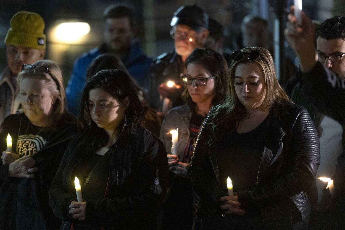 Mourners take a moment of silence during a vigil at the LGBTQ Center of Southern Nevada on Tues ...