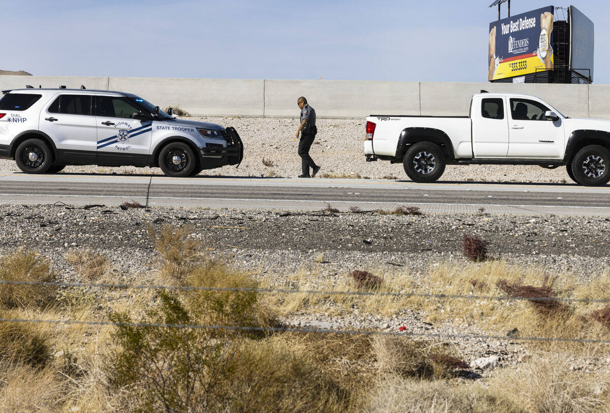 A Nevada Highway Patrol officer returns to his vehicle after issuing a citation for a speeding ...