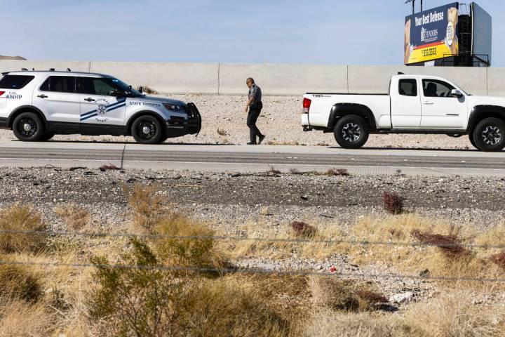 A Nevada Highway Patrol officer returns to his vehicle after issuing a citation for a speeding ...