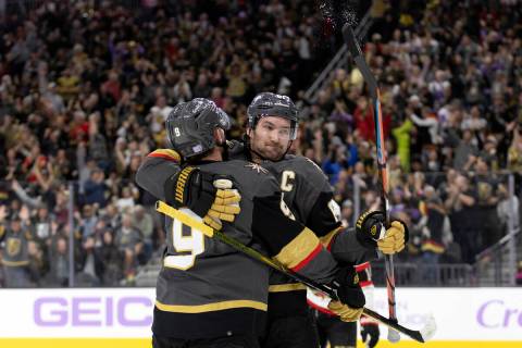Golden Knights right wing Mark Stone (61) celebrates after scoring with center Jack Eichel (9) ...