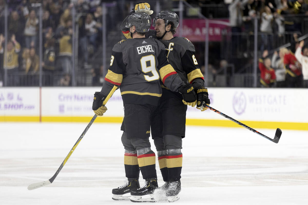 Golden Knights right wing Mark Stone (61) congratulates center Jack Eichel (9) on his goal duri ...