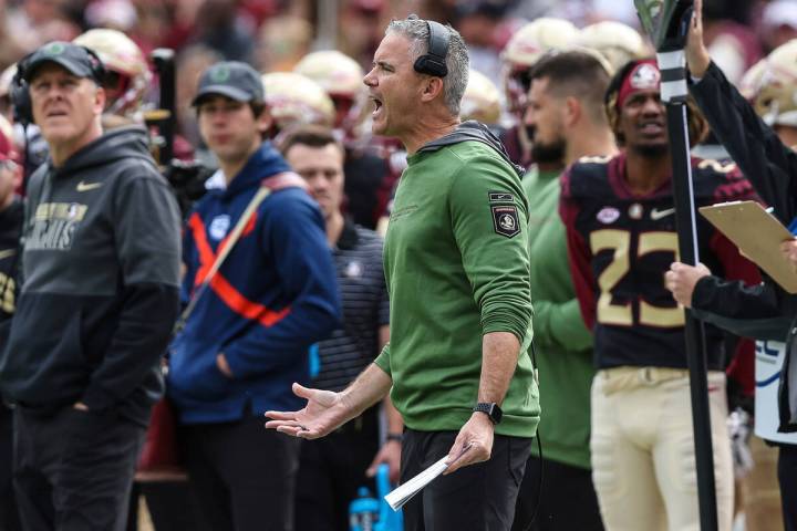 Florida State head coach Mike Norvell reacts during the first half of an NCAA college football ...