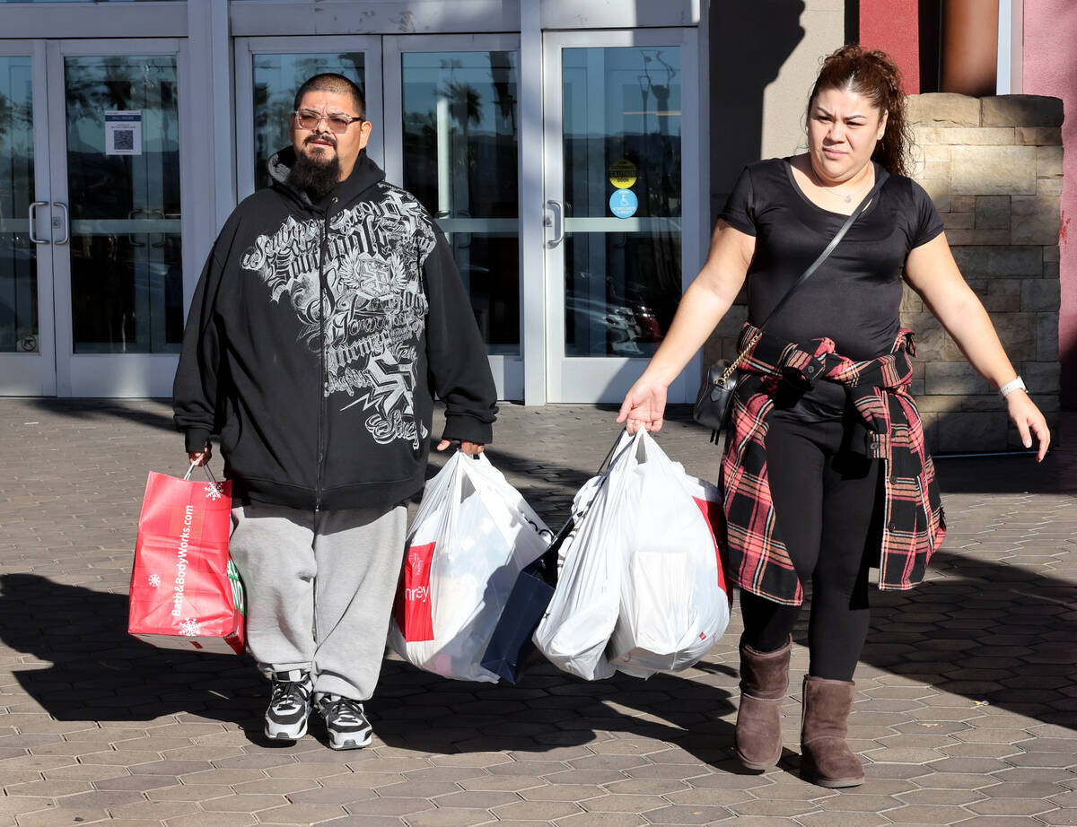 Johnny Ruiz and Yolanda Cardenas walk out of Galleria at Sunset mall in Henderson with their Bl ...