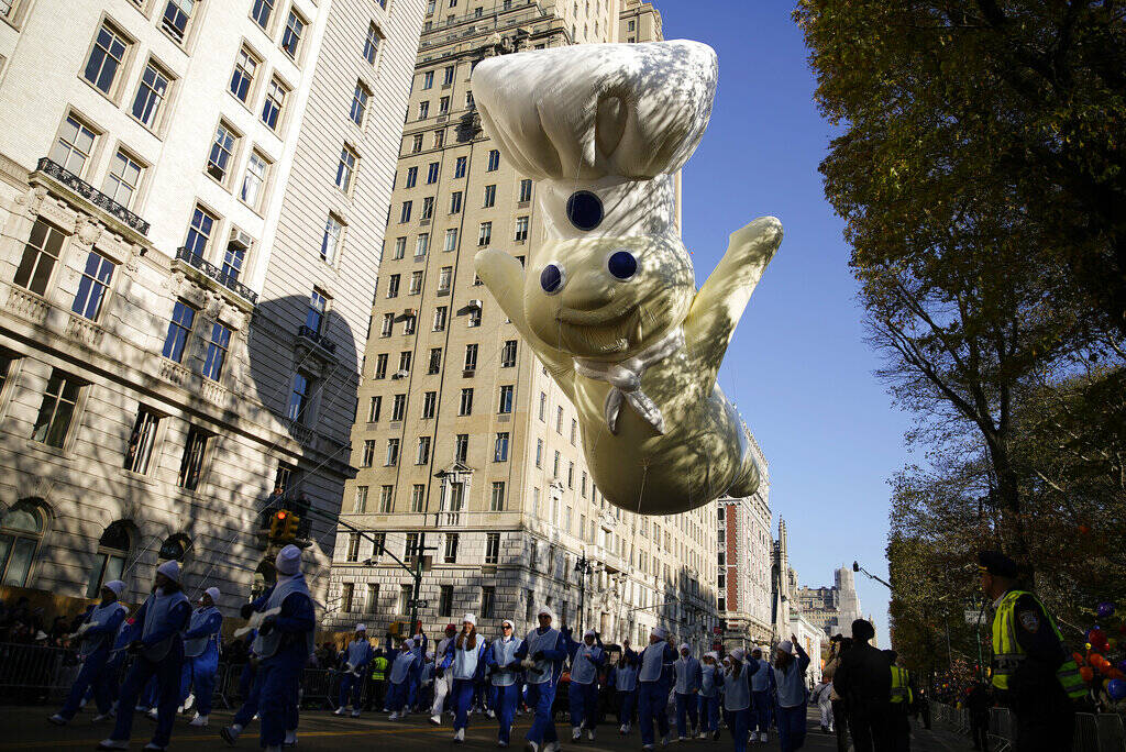 The Pillsbury Doughboy floats down Central Park Avenue West during the Macy's Thanksgiving Day ...