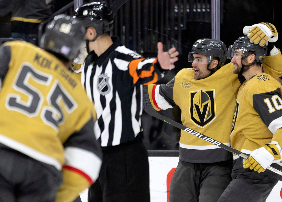 Golden Knights left wing William Carrier (28) and center Nicolas Roy (10) celebrate after Carri ...
