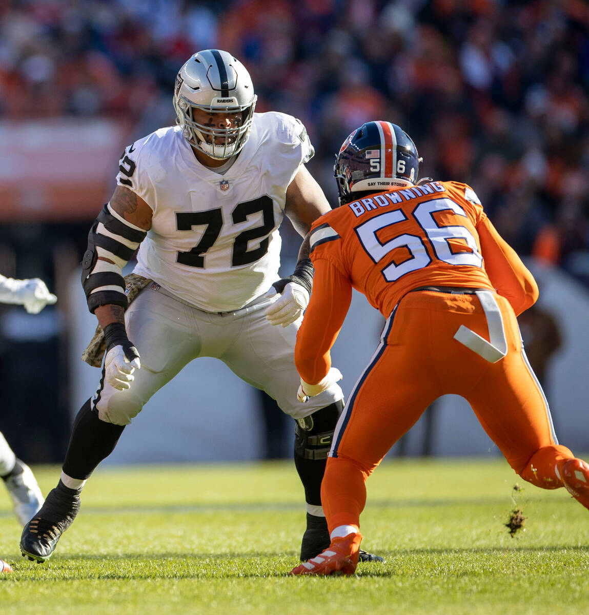 Raiders offensive lineman Jermaine Eluemunor (72) lines up against Denver Broncos linebacker Ba ...