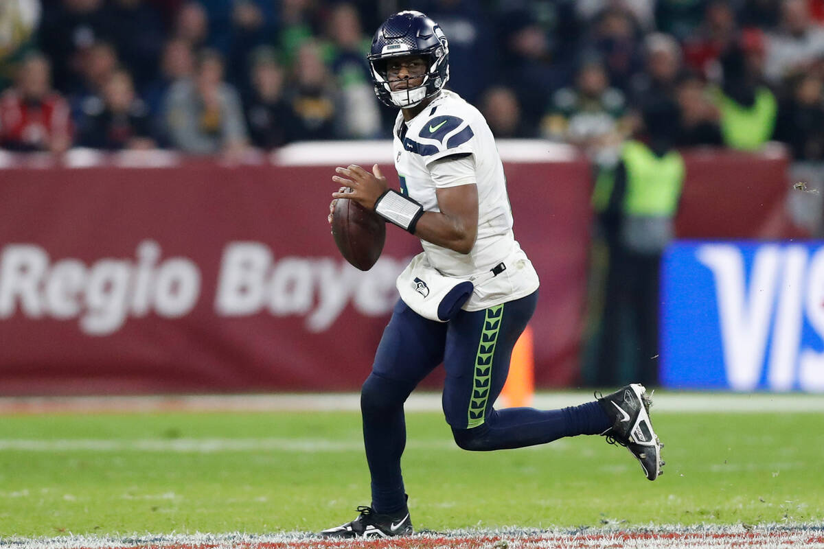 Seattle Seahawks quarterback Geno Smith (7) looks to pass the ball during an NFL football game ...