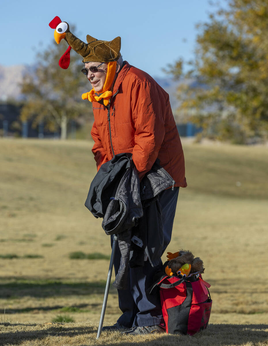 Cleland Cook enjoys watching the participants while during the Wobble Before You Gobble 5K run ...