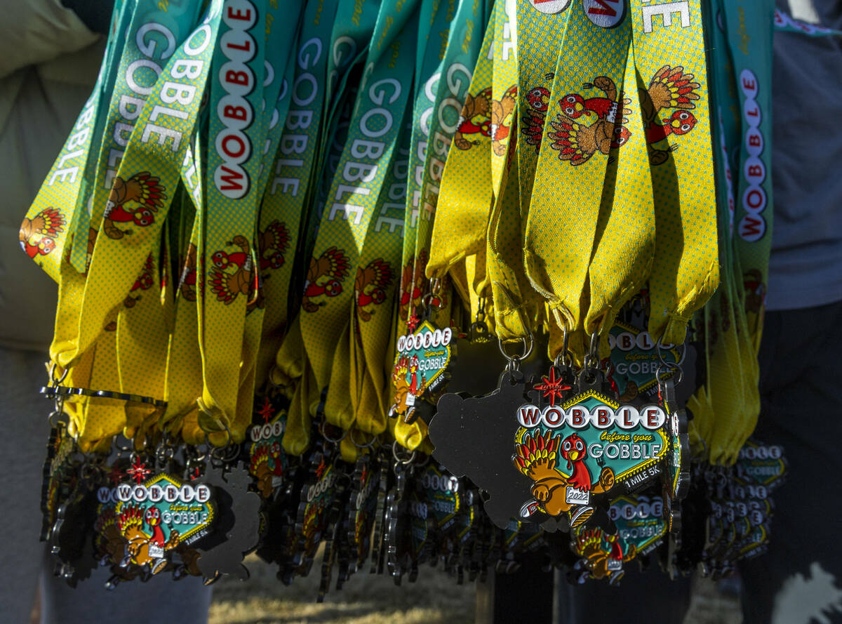Medals await participants at the finish during the Wobble Before You Gobble 5K run at Kellogg Z ...