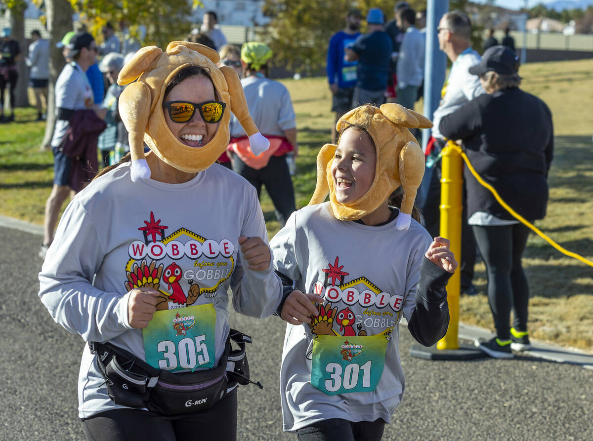 Participants have fun while arriving at the finish line on the course during the Wobble Before ...