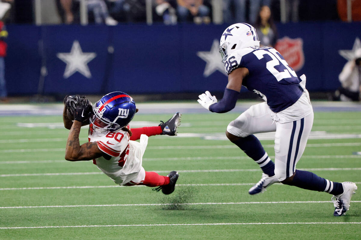 New York Giants wide receiver Richie James (80) catches a pass as Dallas Cowboys cornerback DaR ...