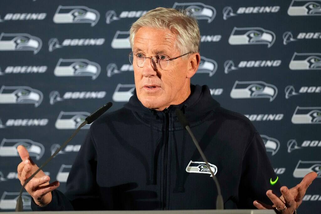 Seattle Seahawks head coach Pete Carroll gestures during a news conference after a practice ses ...