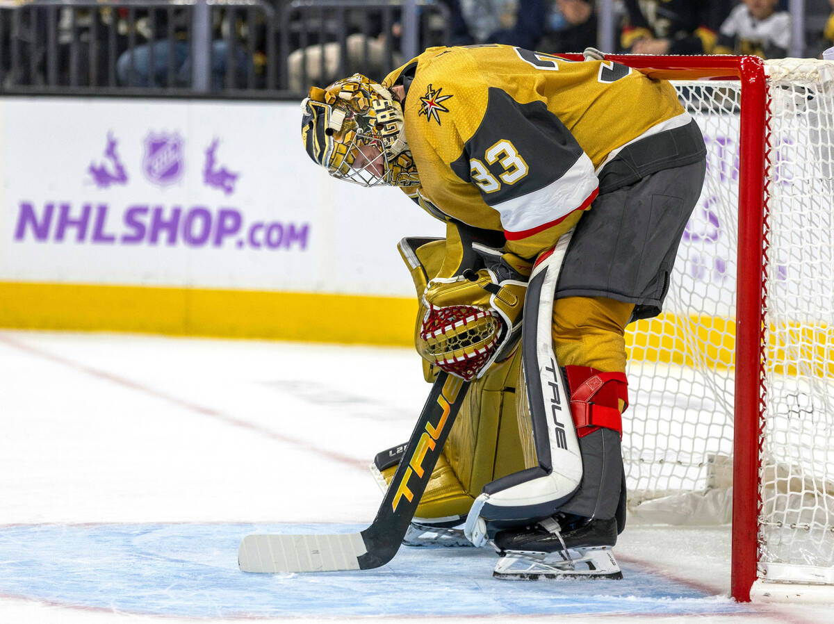 Golden Knights goaltender Adin Hill (33) is dejected after missing another goal score by the Se ...