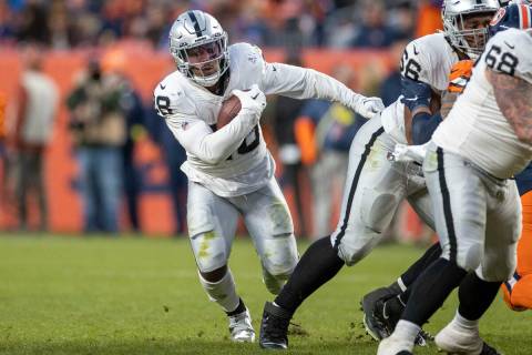Raiders running back Josh Jacobs (28) runs with the football during the second half of an NFL g ...