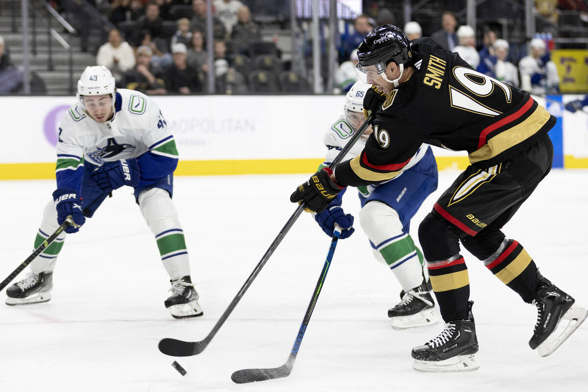 Golden Knights right wing Reilly Smith (19) takes a shot on goal against Canucks right wing Ily ...