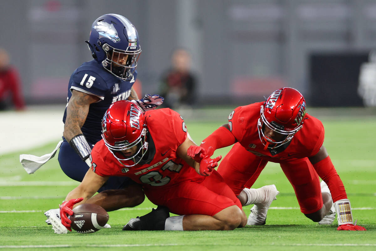 UNLV Rebels defensive back Lacarea Pleasant-Johnson (31) recovers a ball as Nevada Wolf Pack de ...