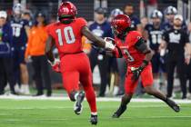 UNLV Rebels defensive back Johnathan Baldwin (3) intercepts the ball against the Nevada Wolf Pa ...