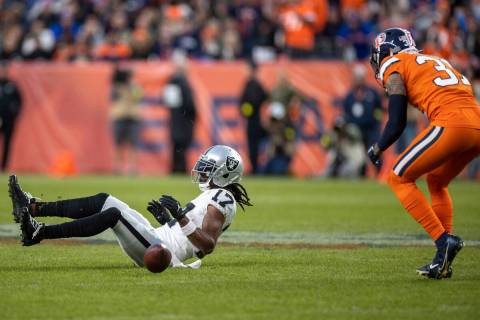 Raiders wide receiver Davante Adams (17) can’t make a catch with Denver Broncos safety J ...