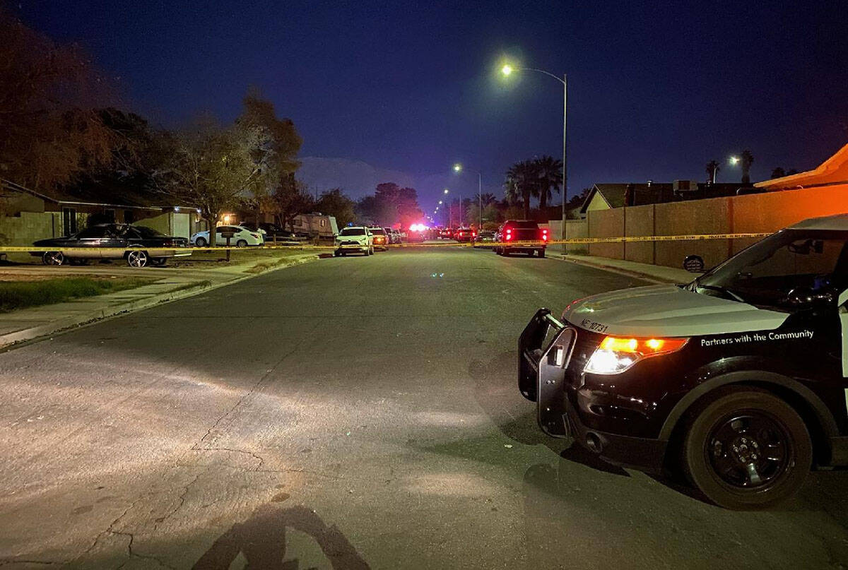 A Metro squad car and crime scene tape at the scene of a homicide in the 4800 block of Ballanti ...