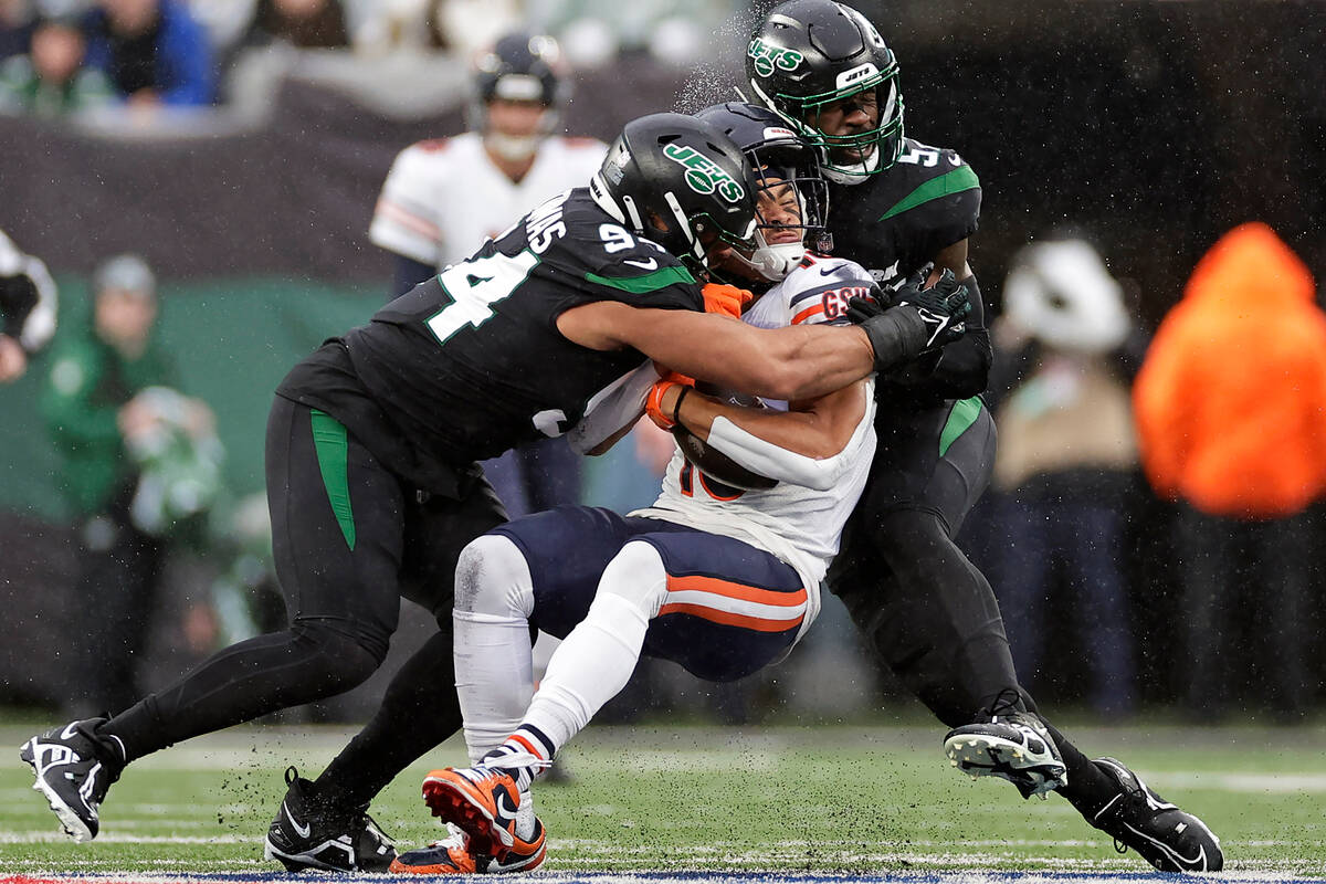 Chicago Bears wide receiver Chase Claypool (10) is tackled by New York Jets defensive end Solom ...