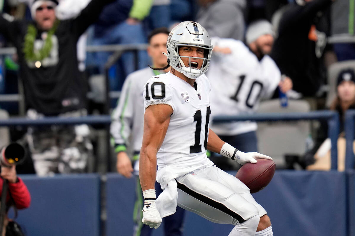 Las Vegas Raiders wide receiver Mack Hollins (10) celebrates his touchdown catch during the fir ...
