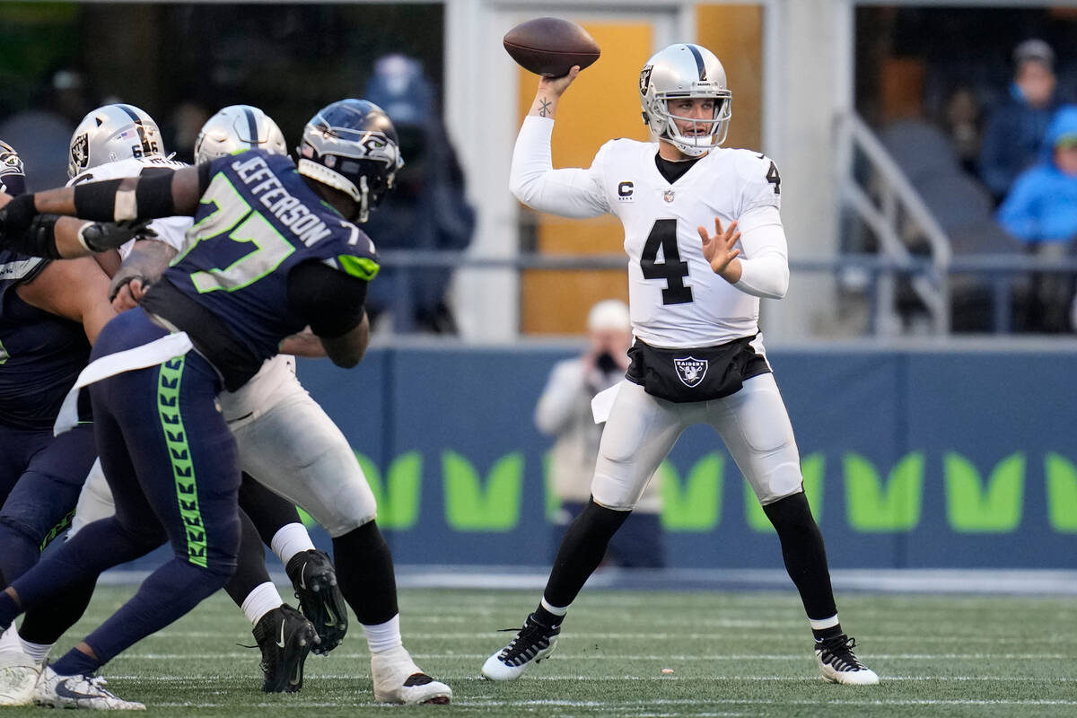 Las Vegas Raiders quarterback Derek Carr (4) throws against the Seattle Seahawks during the sec ...