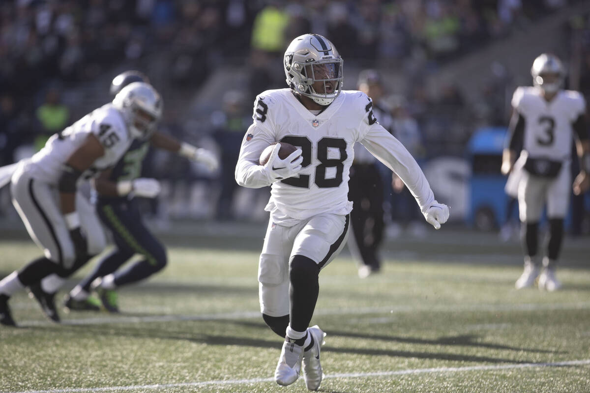 Raiders running back Josh Jacobs (28) has room to run during the first half of an NFL game at L ...