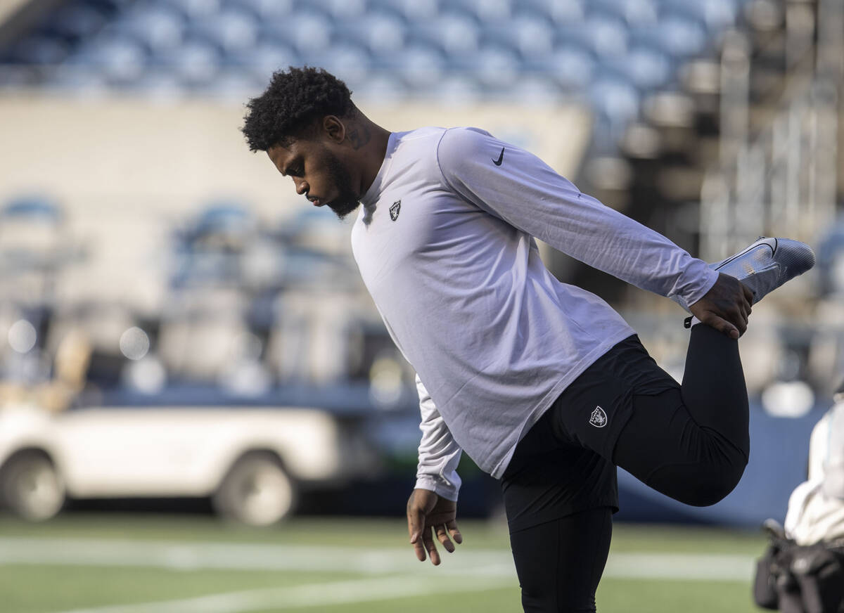 Raiders running back Josh Jacobs stretches before an NFL game against the Seattle Seahawks at L ...