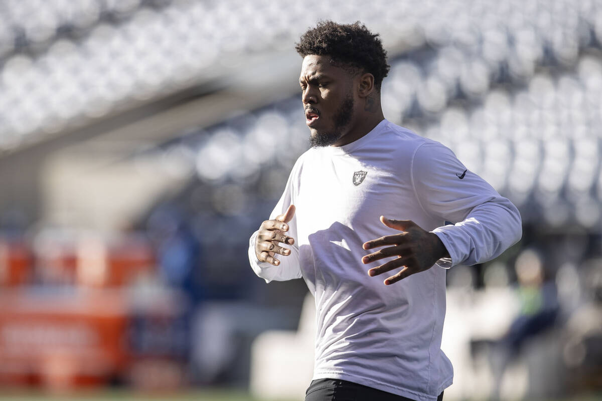 Raiders running back Josh Jacobs stretches before an NFL game against the Seattle Seahawks at L ...