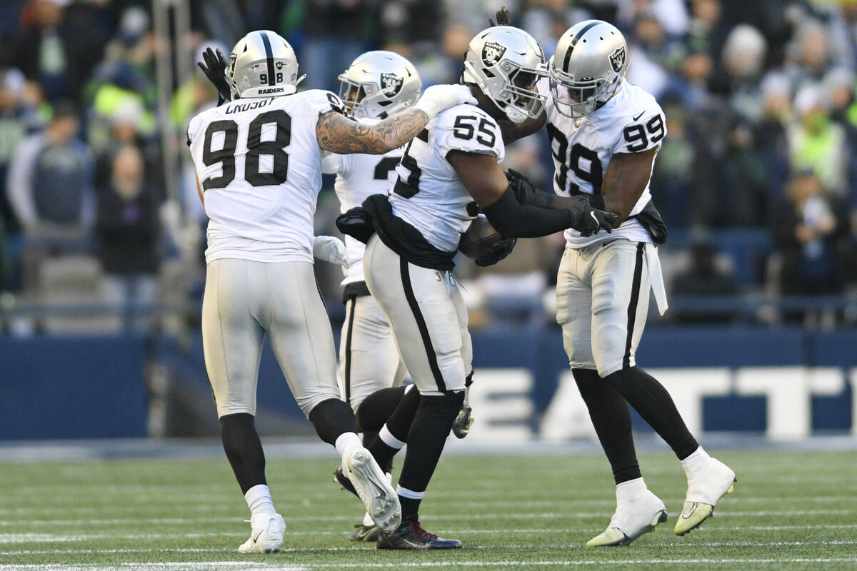 Las Vegas Raiders defensive end Chandler Jones (55) recovers a fumble during the second half of ...