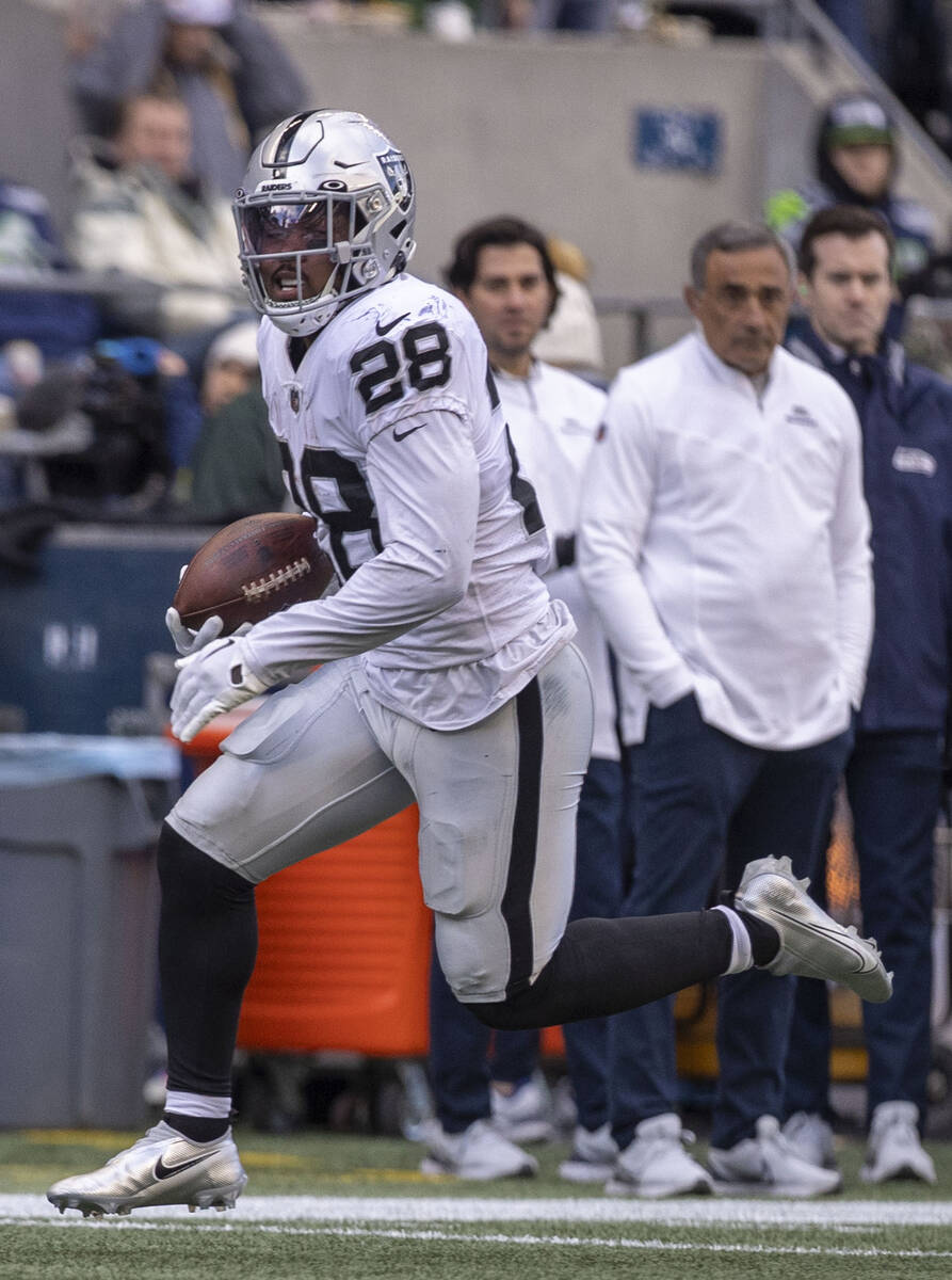 Raiders running back Josh Jacobs (28) heads to the end zone during the first half of an NFL gam ...