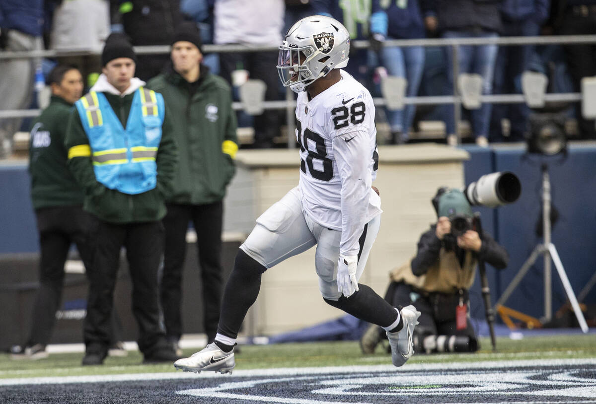 Raiders running back Josh Jacobs (28) scores a touchdown during the first half of an NFL game a ...