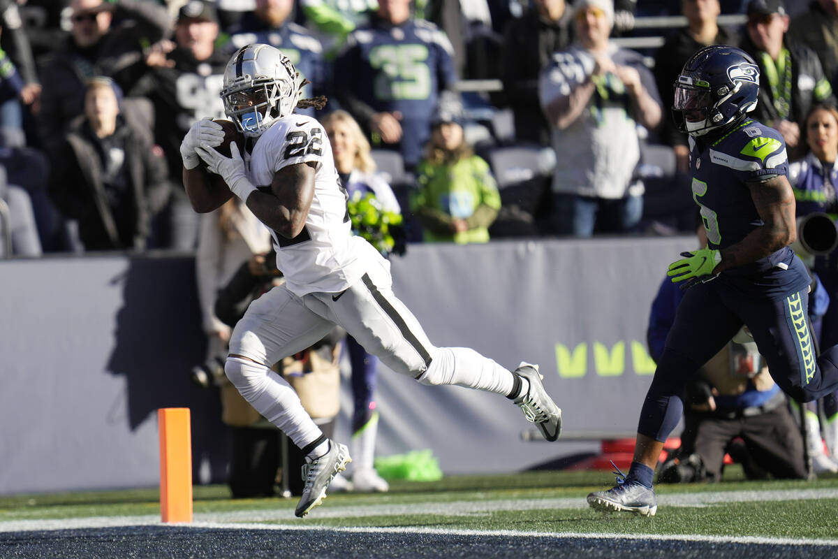 Las Vegas Raiders running back Ameer Abdullah (22) catches a touchdown pass past Seattle Seahaw ...