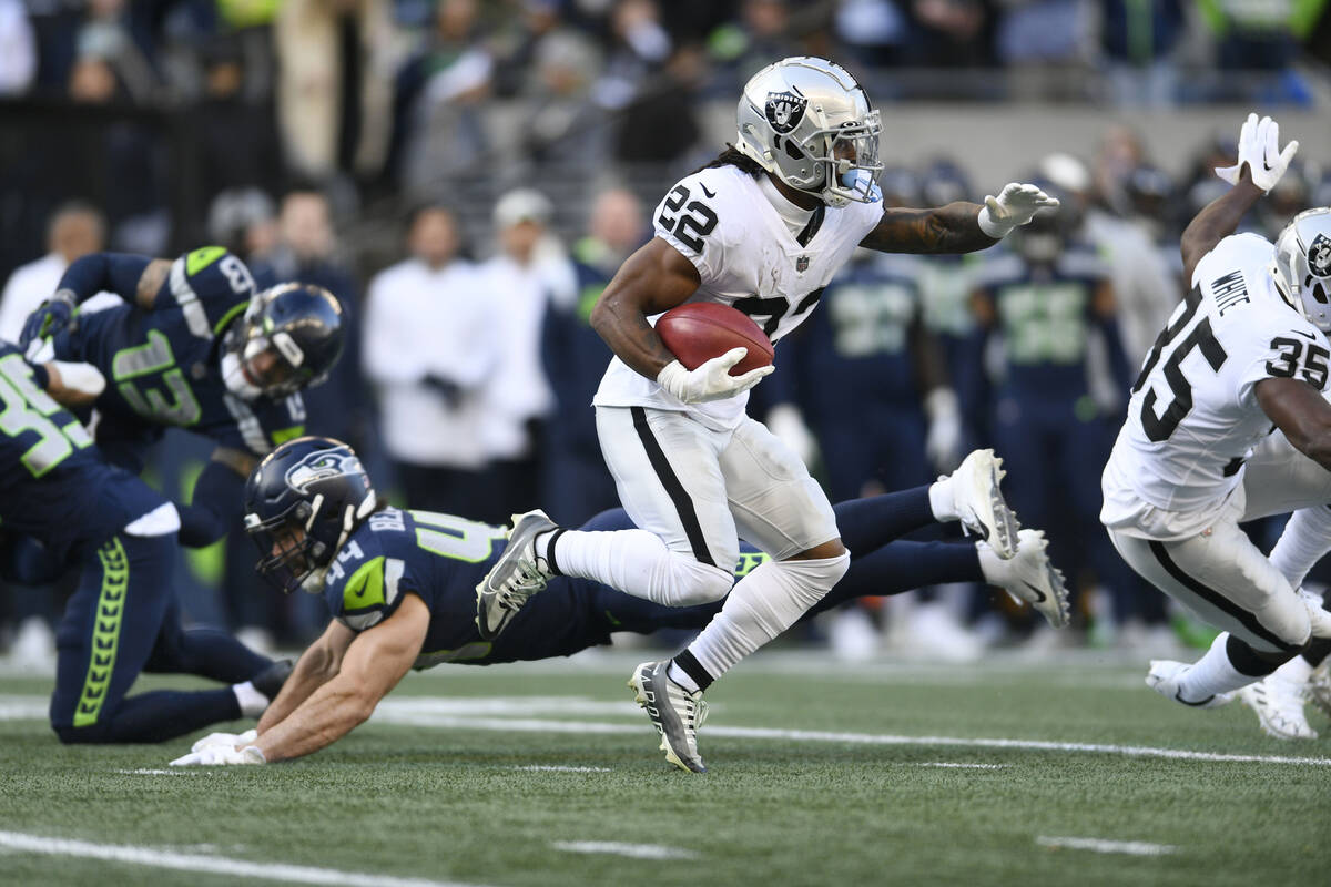 Las Vegas Raiders running back Ameer Abdullah carries against the Seattle Seahawks during the f ...