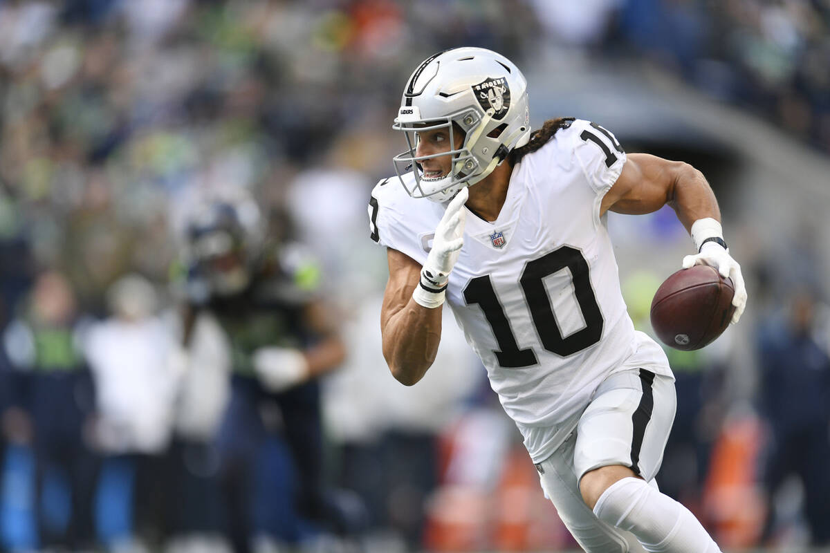 Las Vegas Raiders wide receiver Mack Hollins runs for a touchdown during the first half of an N ...