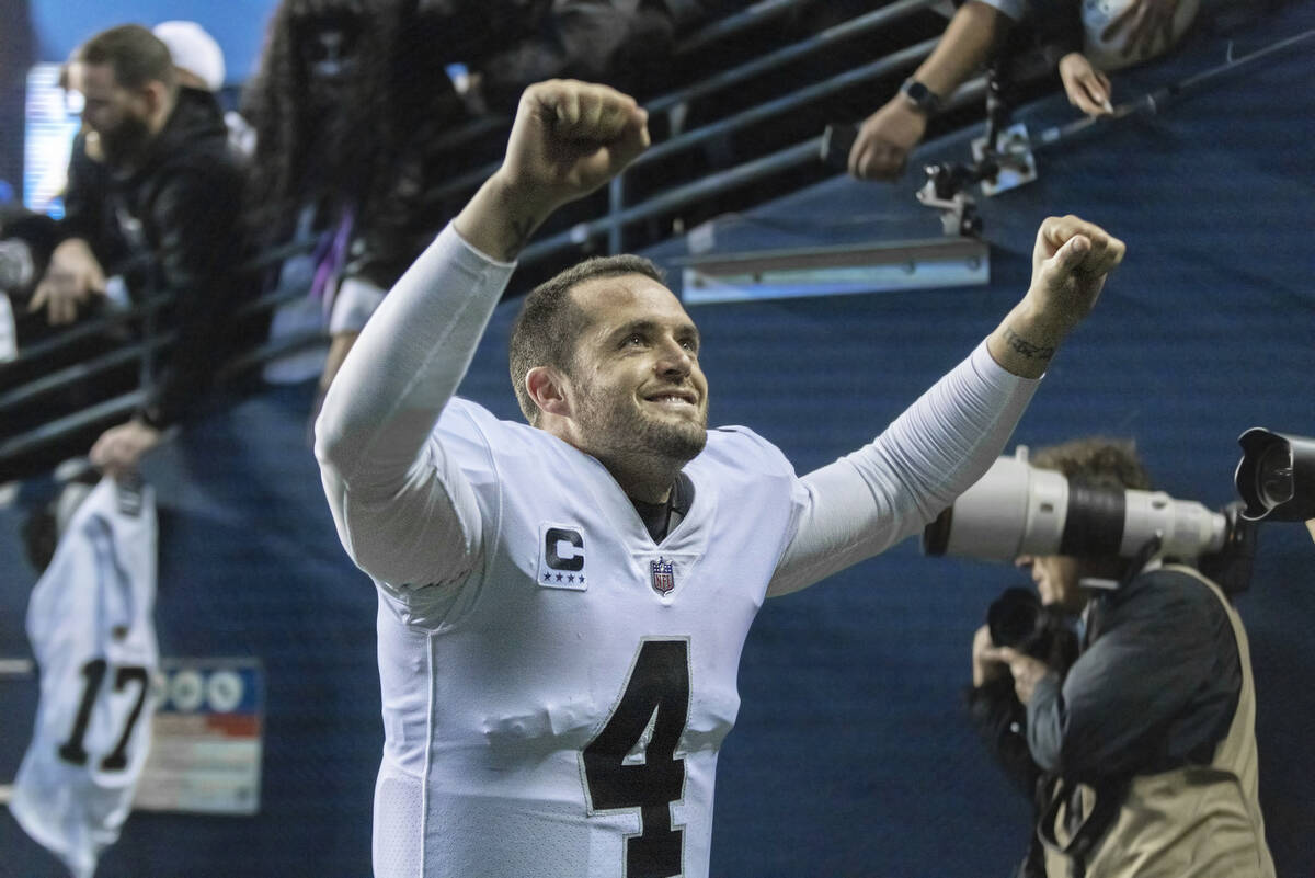 Raiders quarterback Derek Carr (4) walks off the field following the team’s 40-34 overti ...