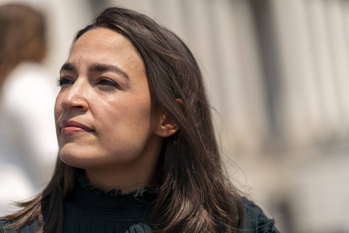 FILE - Rep. Alexandria Ocasio-Cortez, D-N.Y., joins female House Democrats at an event ahead of ...