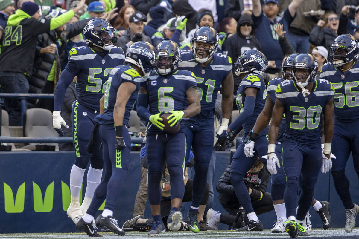 Seattle Seahawks safety Quandre Diggs (6) celebrates his interception with teammates during the ...