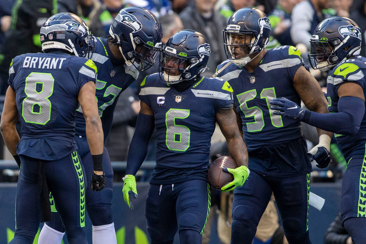 Seattle Seahawks safety Quandre Diggs (6) celebrates his interception with teammates during the ...