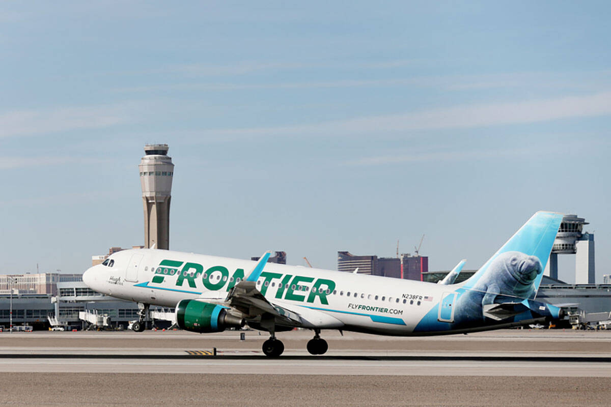 A Frontier Airlines plane lands at the McCarran International Airport in Las Vegas on Thursday, ...