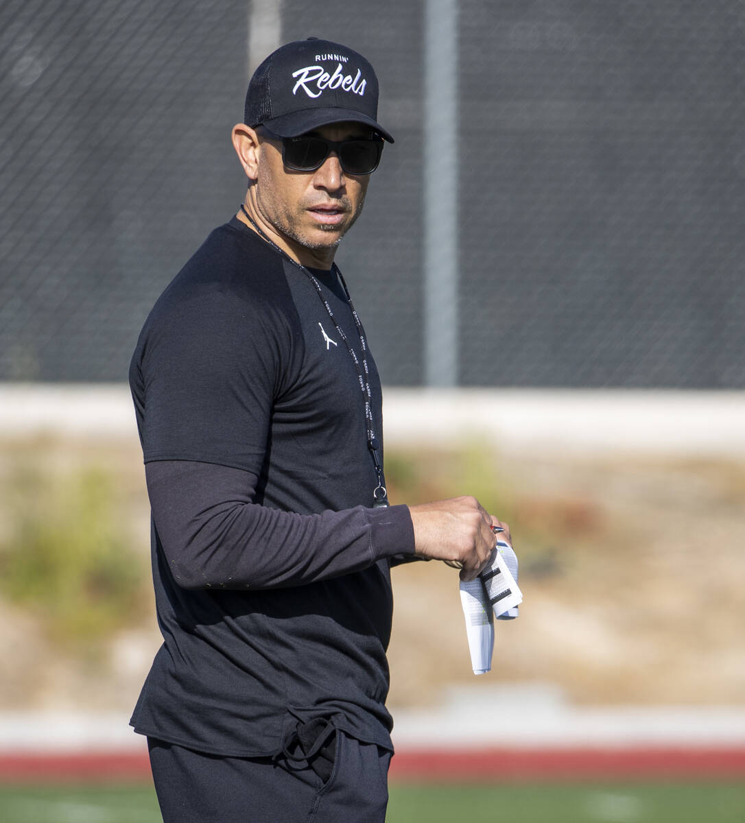 UNLV head coach Marcus Arroyo eyes his players during the first spring football practice at Reb ...