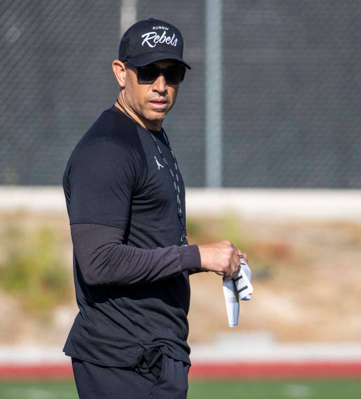 UNLV head coach Marcus Arroyo eyes his players during the first spring football practice at Reb ...