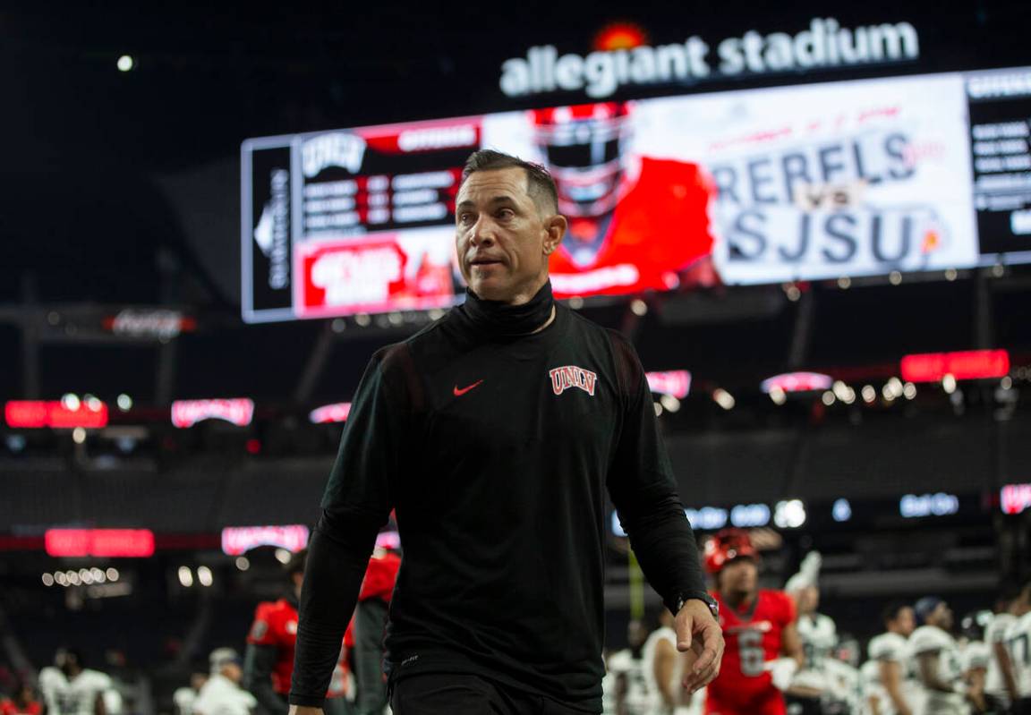 UNLV Rebels head coach Marcus Arroyo walks off the field after losing to Utah State at the end ...