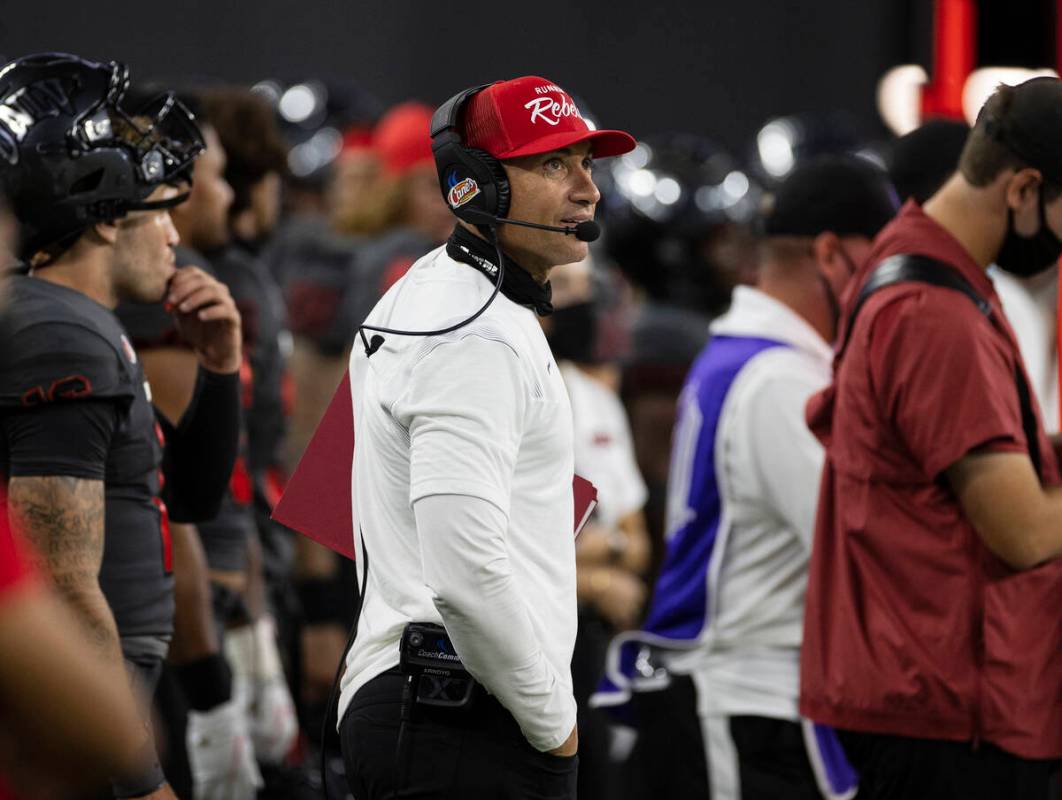 UNLV Rebels head coach Marcus Arroyo watches the clock during the fourth quarter of an NCAA foo ...