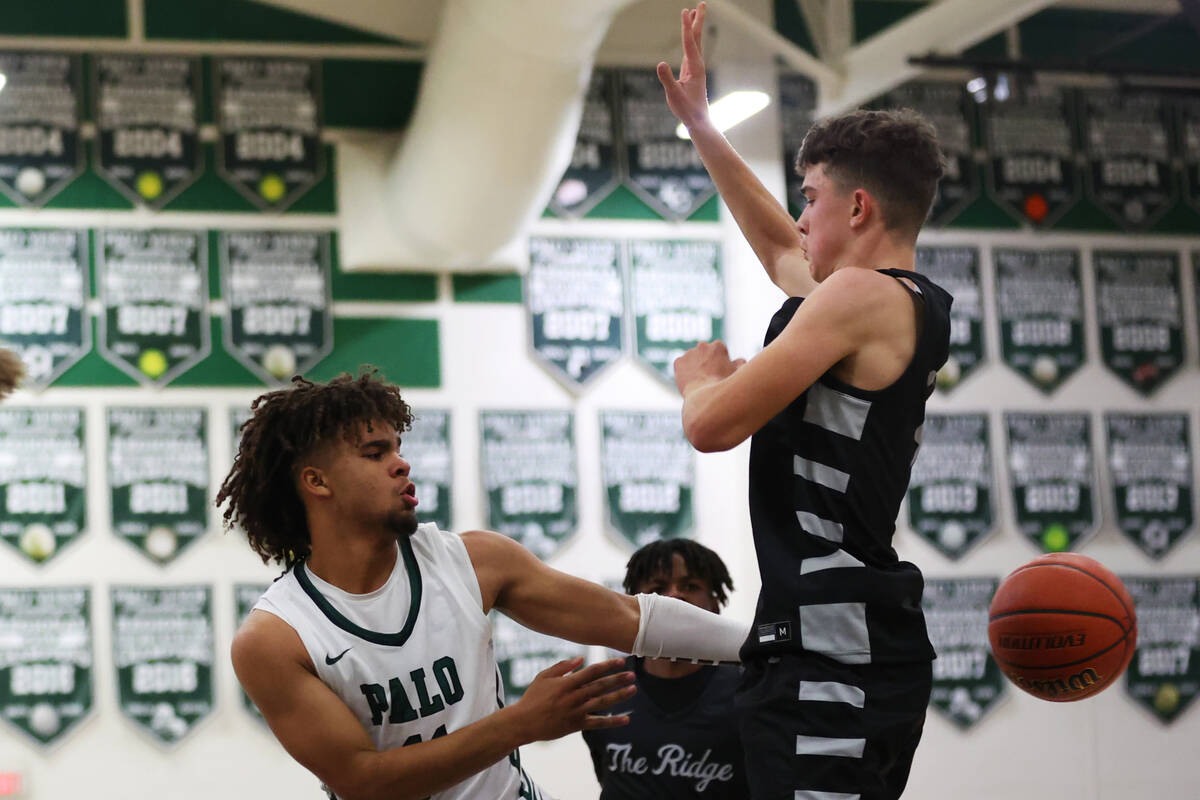 Palo Verde's Jalen Sharpe (11) makes a pass behind the back of Shadow Ridge's Liam Guthrie (4) ...