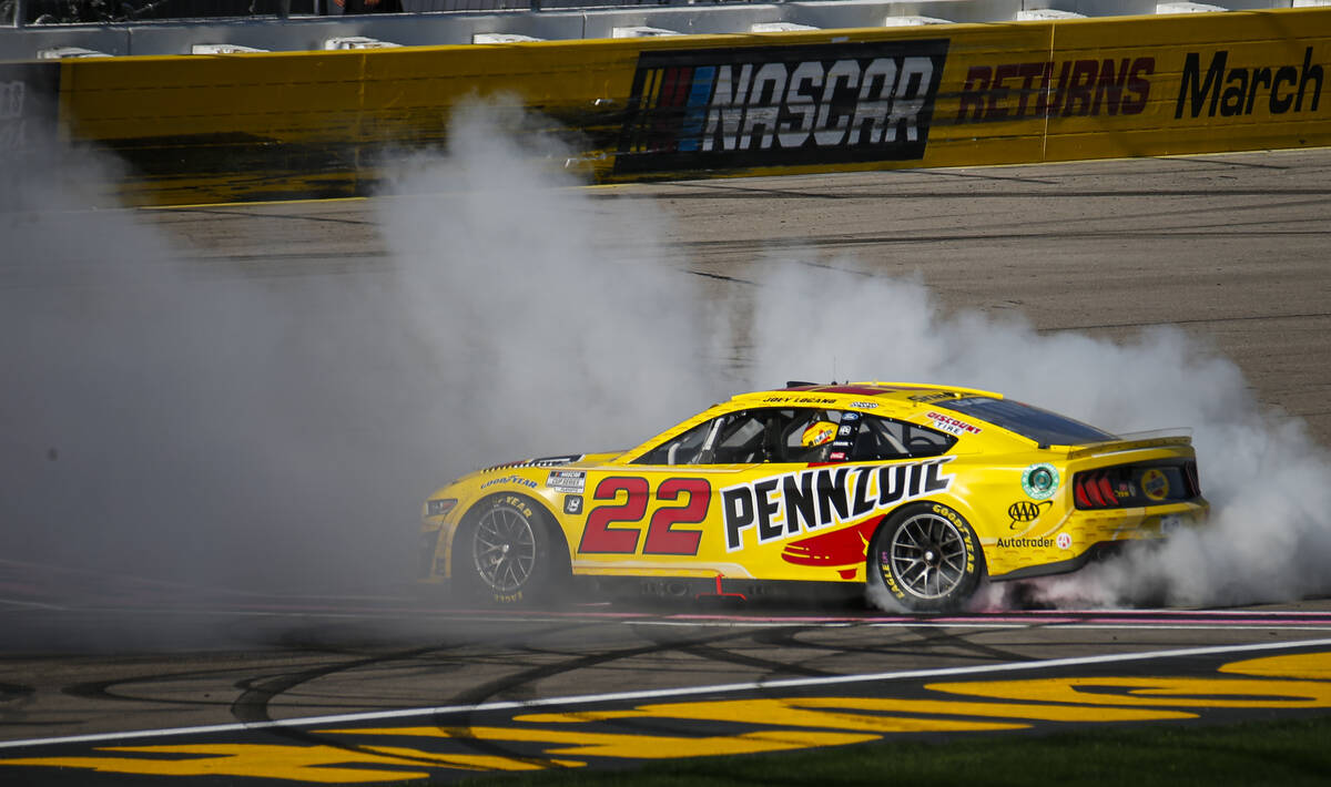 NASCAR Cup Series driver Joey Logano does a burnout after winning the South Point 400 NASCAR Cu ...