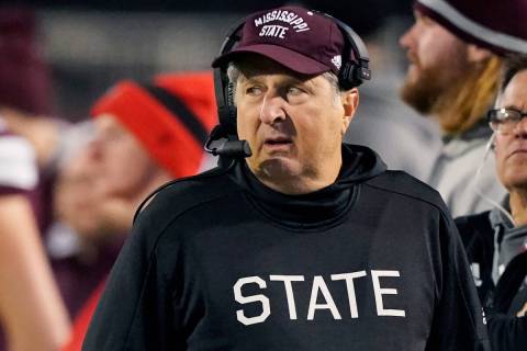 Mississippi State head coach Mike Leach looks across the field at his team during the second ha ...