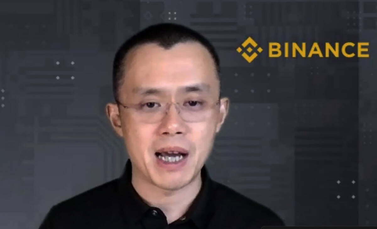 FILE - Binance CEO Changpeng Zhao answers a question during a Zoom meeting interview with The A ...