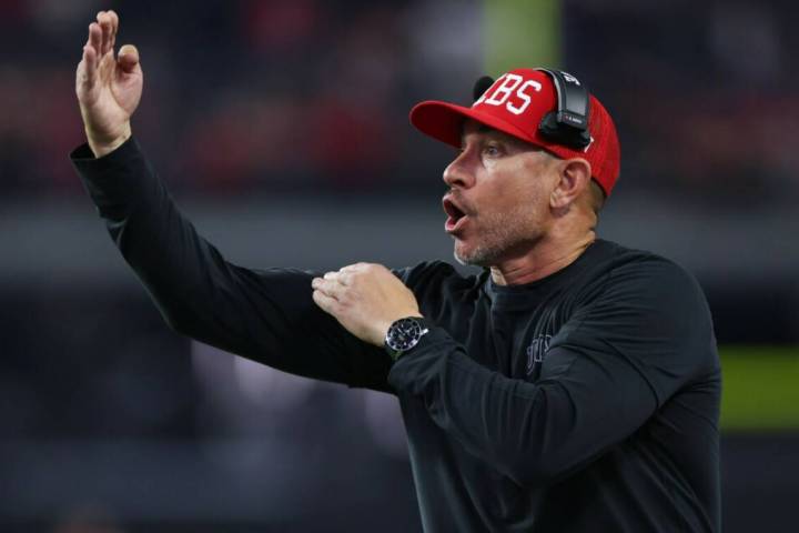 UNLV Rebels head coach Marcus Arroyo yells from the sidelines during a play in the second half ...